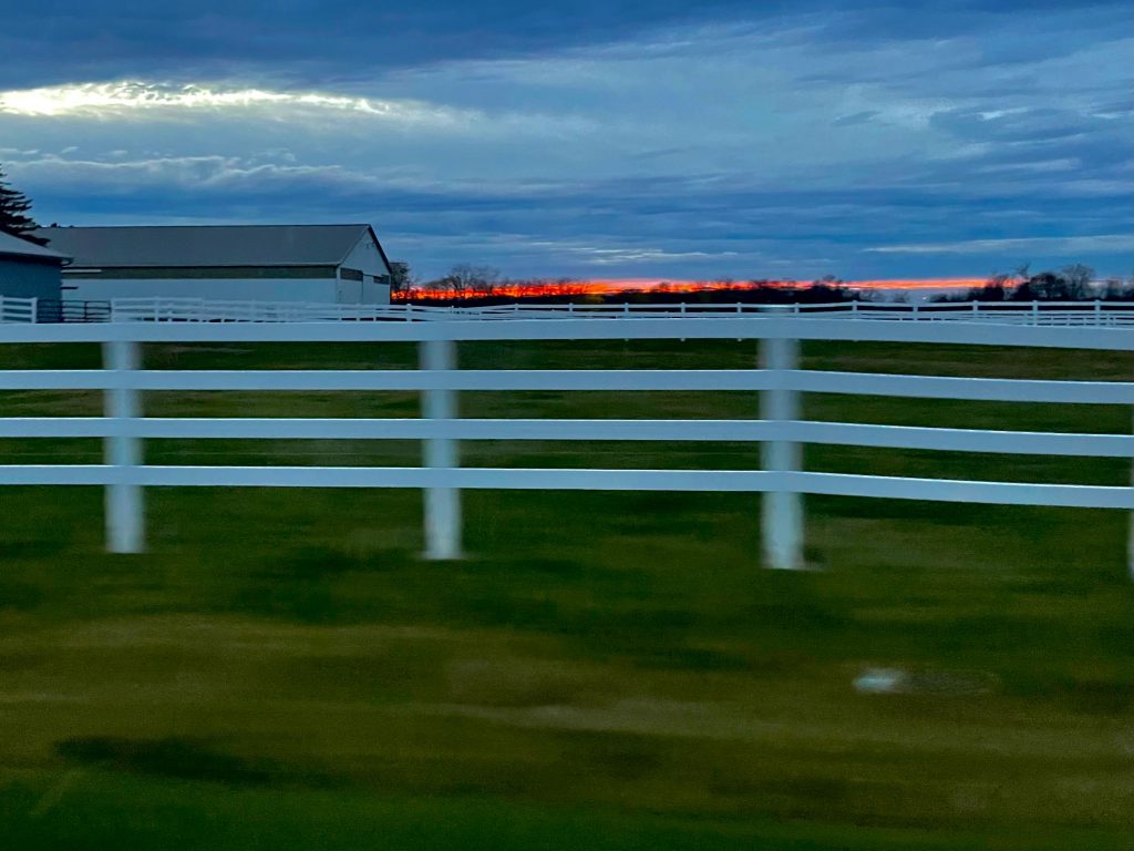 Sun sets over farmland